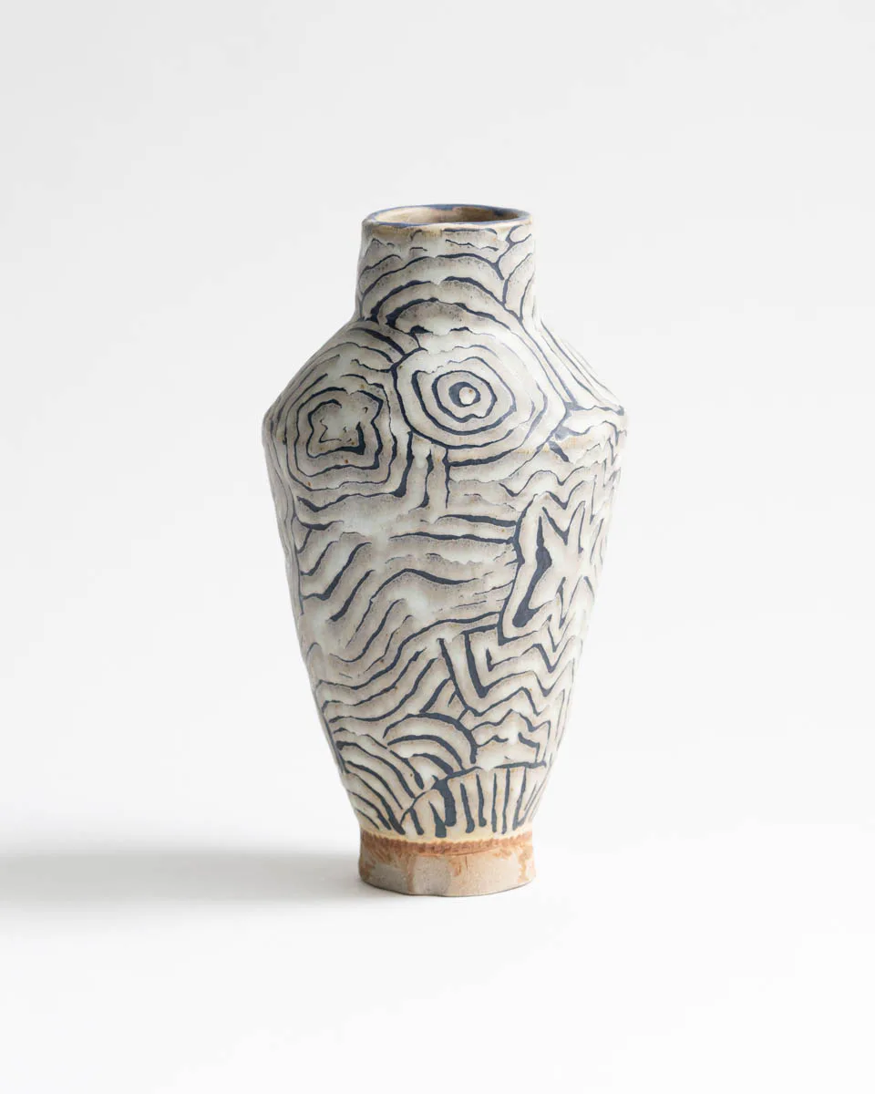 Large ceramic vase with bold contour line pattern in blue-grey on white ground