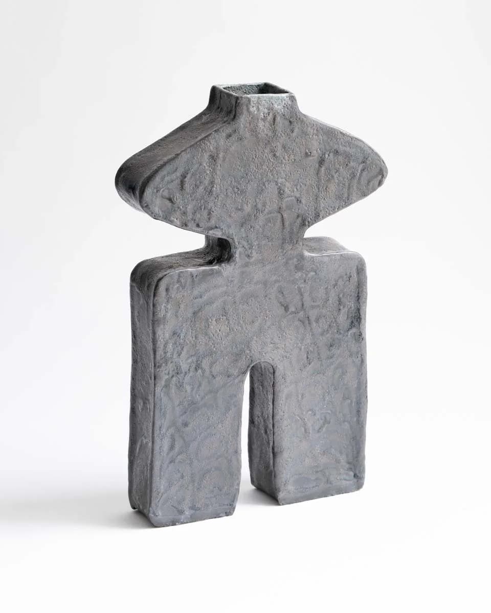 Anthropomorphic grey ceramic vessel with wide winged shoulders and square neck opening