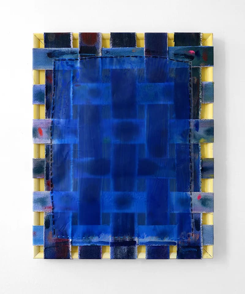 Abstract mixed-media work with woven blue and beige canvas strips on a deep blue painted ground