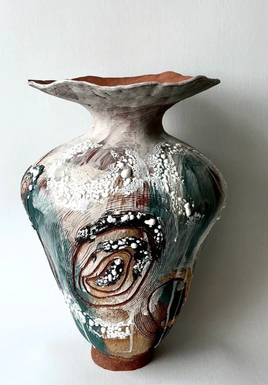 Tall ceramic vase with wide flared rim, teal, brown and white abstract glaze with raised bubble texture