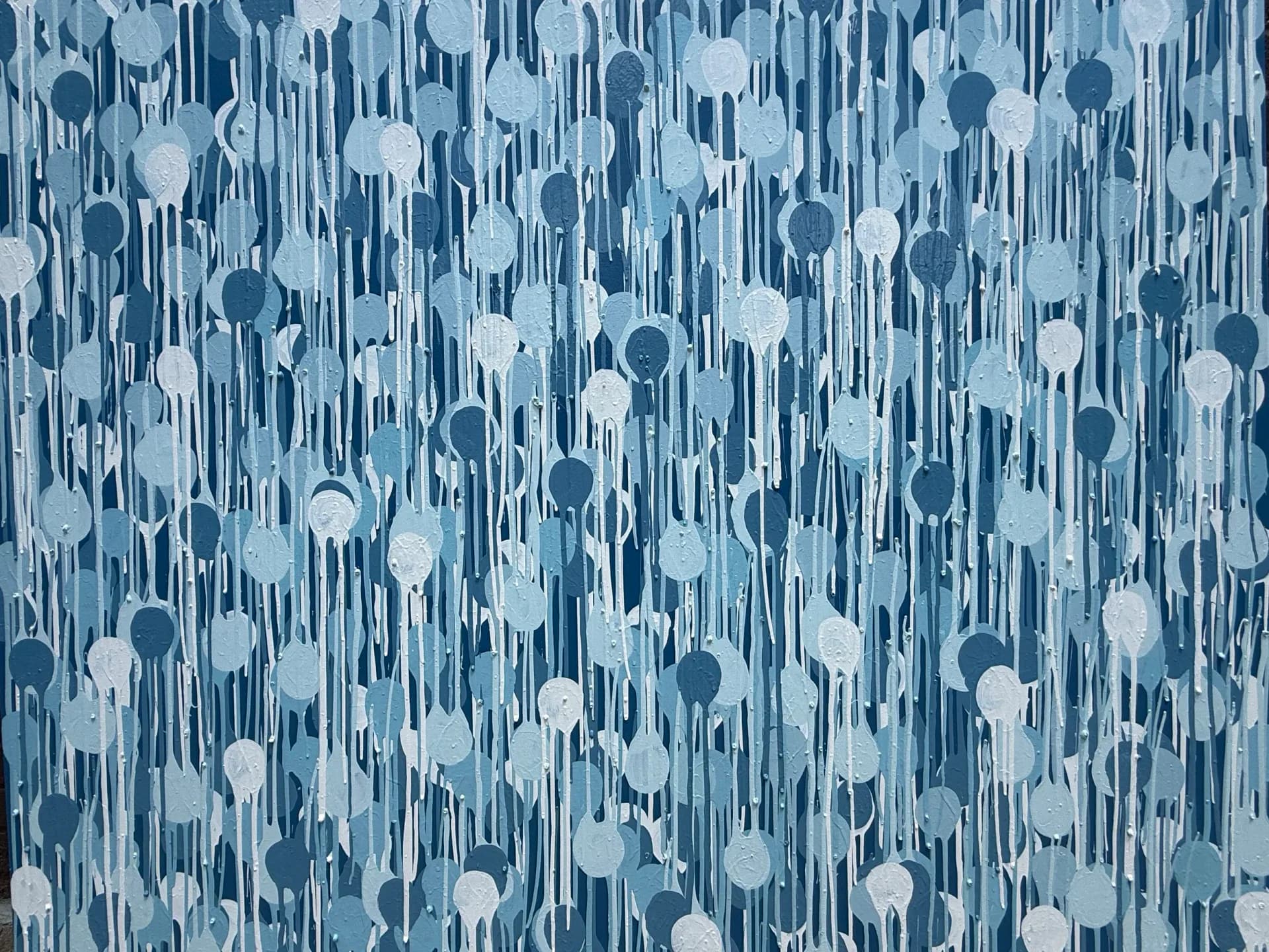 Abstract painting with vertical blue and white streaks interspersed with circular shapes in varying shades of blue.