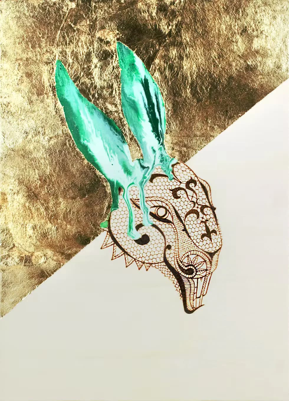 Ornate lace rabbit head with teal painted ears on split gold leaf and white background