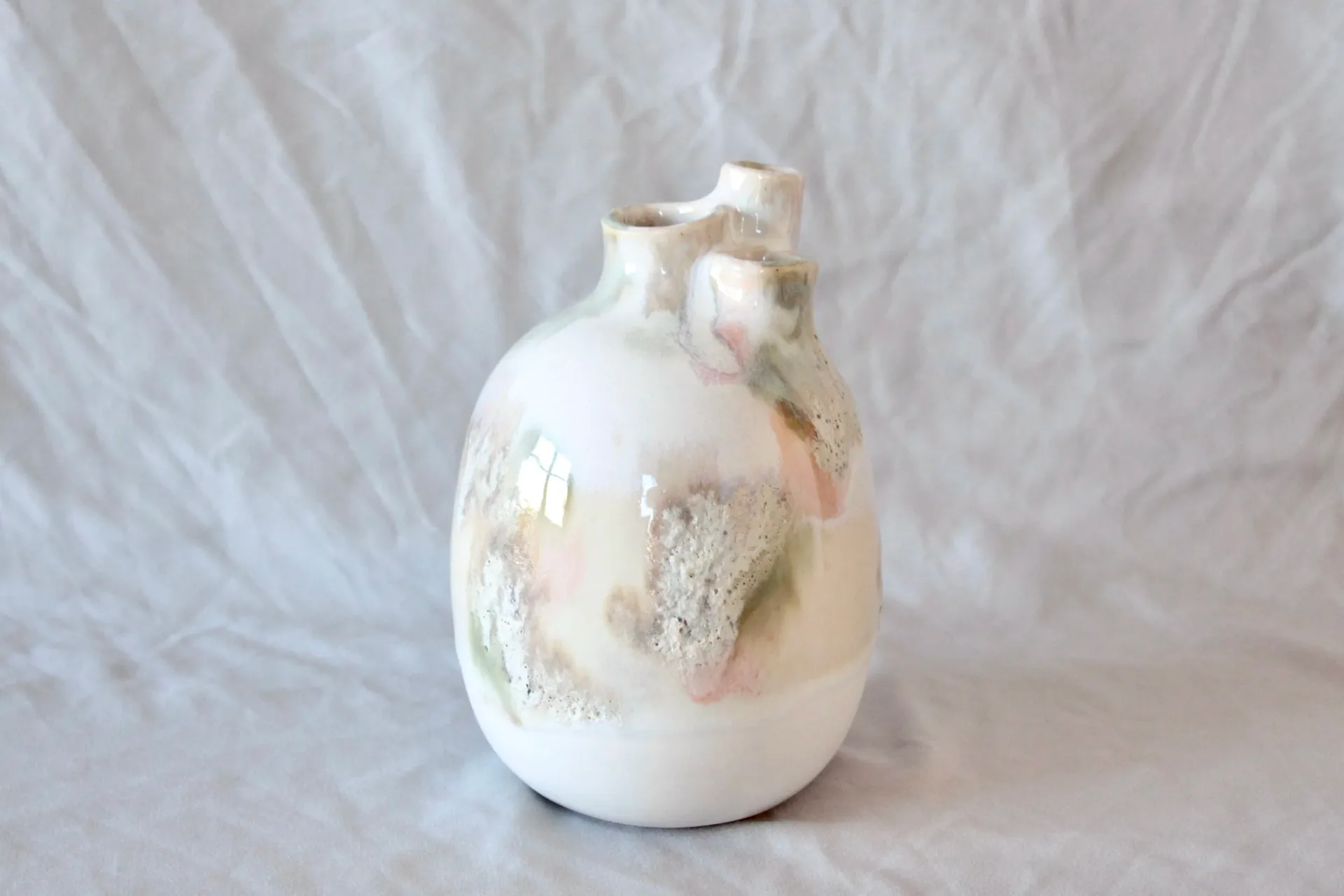 Sculptural dark grey twisted vase with dried wildflowers