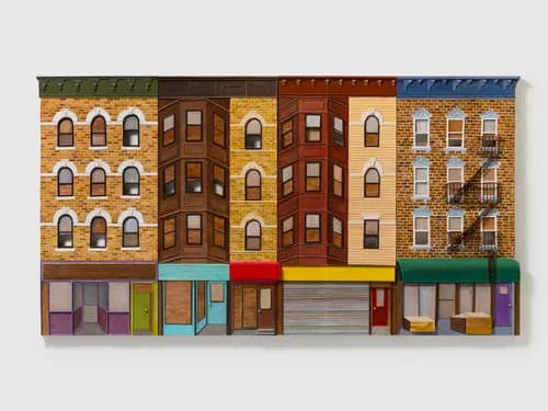 Colorful painted relief of urban building facades with brick storefronts
