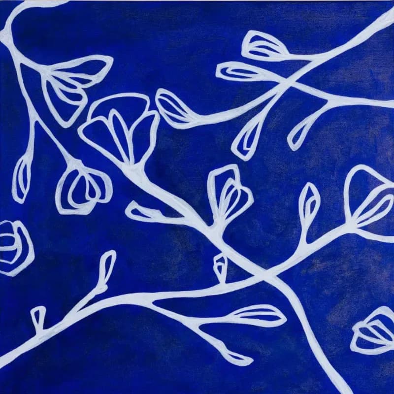 Blue and white acrylic painting of magnolia branches on cobalt background