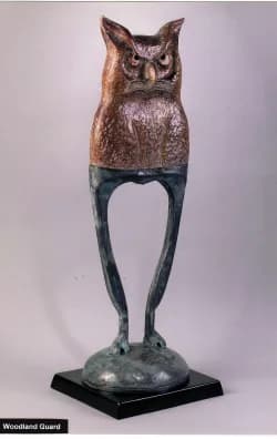 Bronze sculpture of an owl-headed figure with elongated human legs on a black base, titled Woodland Guard.