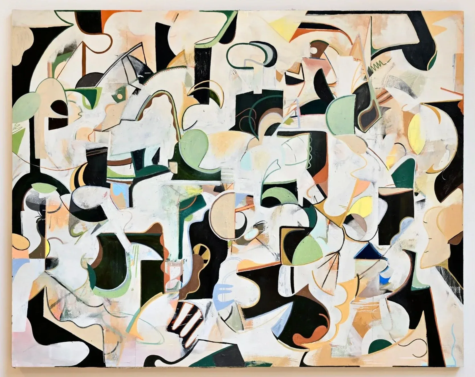 Large-scale abstract painting with black, white, green and peach organic forms, close-up view