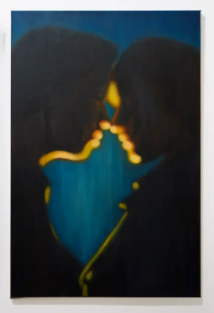 Two silhouetted figures about to kiss with glowing blue and gold light between them