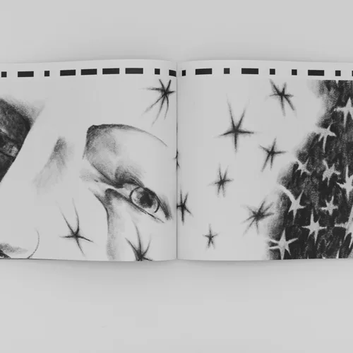 Open book spread with pencil drawing of a face with star motifs
