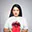 Headshot of a woman with long dark hair wearing a red and white top against white background, looking directly at camera.