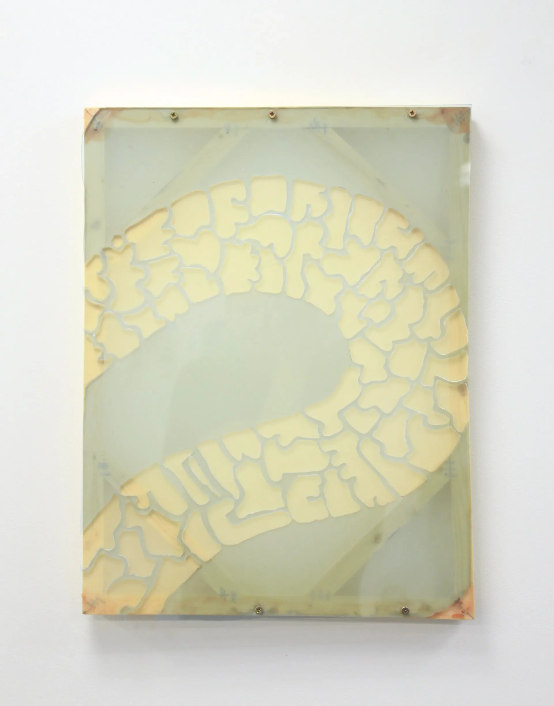 Wall-mounted resin panel with yellow segmented spiral form on pale blue-green ground, bolted at corners