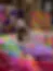 Heavily blurred abstract image with pink and purple tones; content unclear due to extreme pixelation.