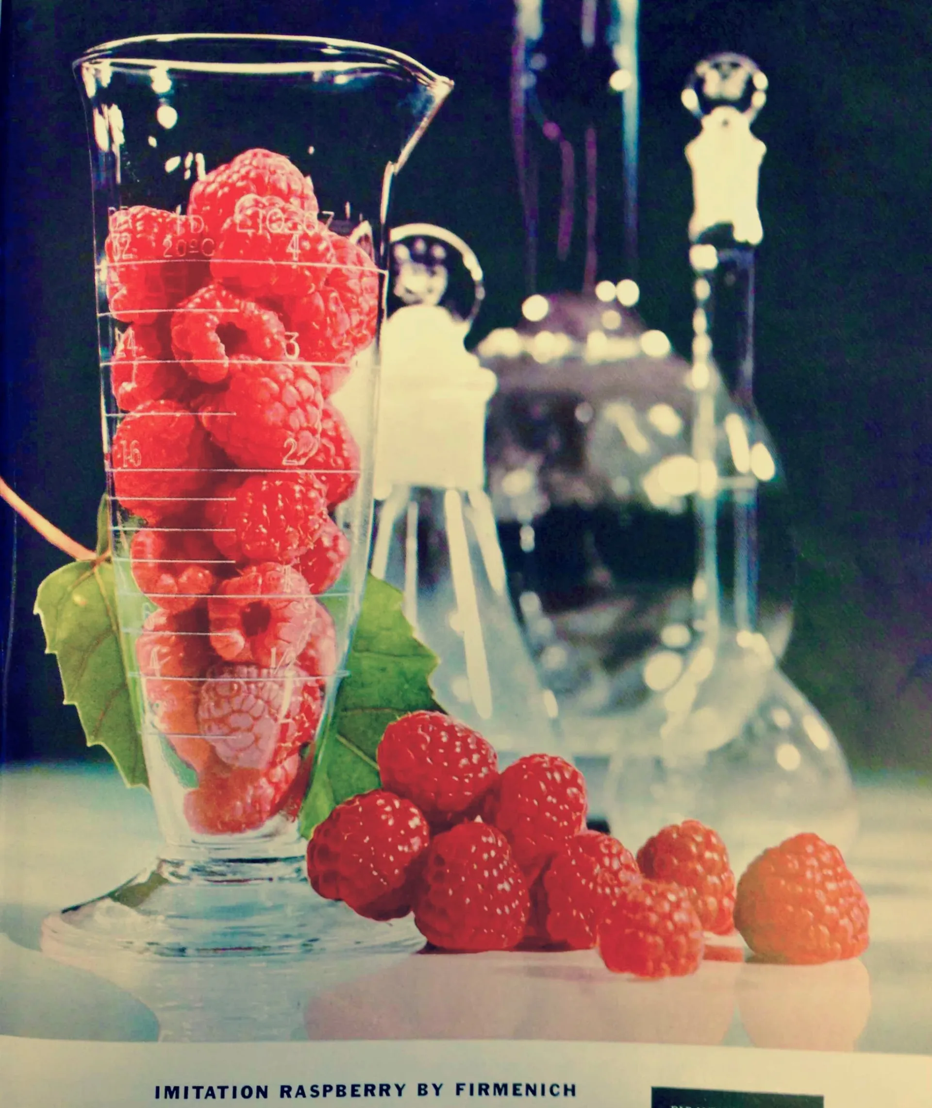 Firmenich Imitation Raspberry advertisement with raspberries in laboratory beaker