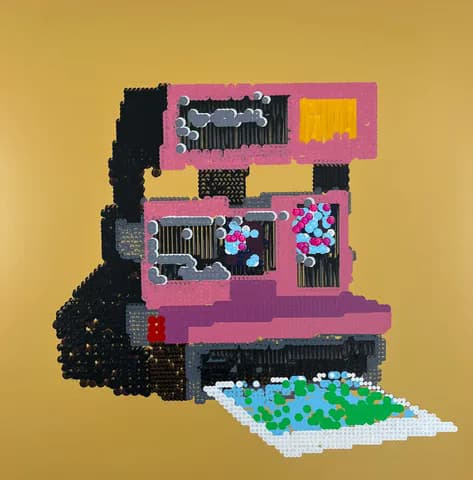 Pink Polaroid camera made of circular dot elements on gold background