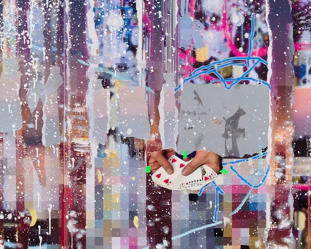 Aerial view of a vibrant urban street layered with digital collage elements, fragmented photographs, and neon pink and blue overlays creating a dreamlike cityscape.