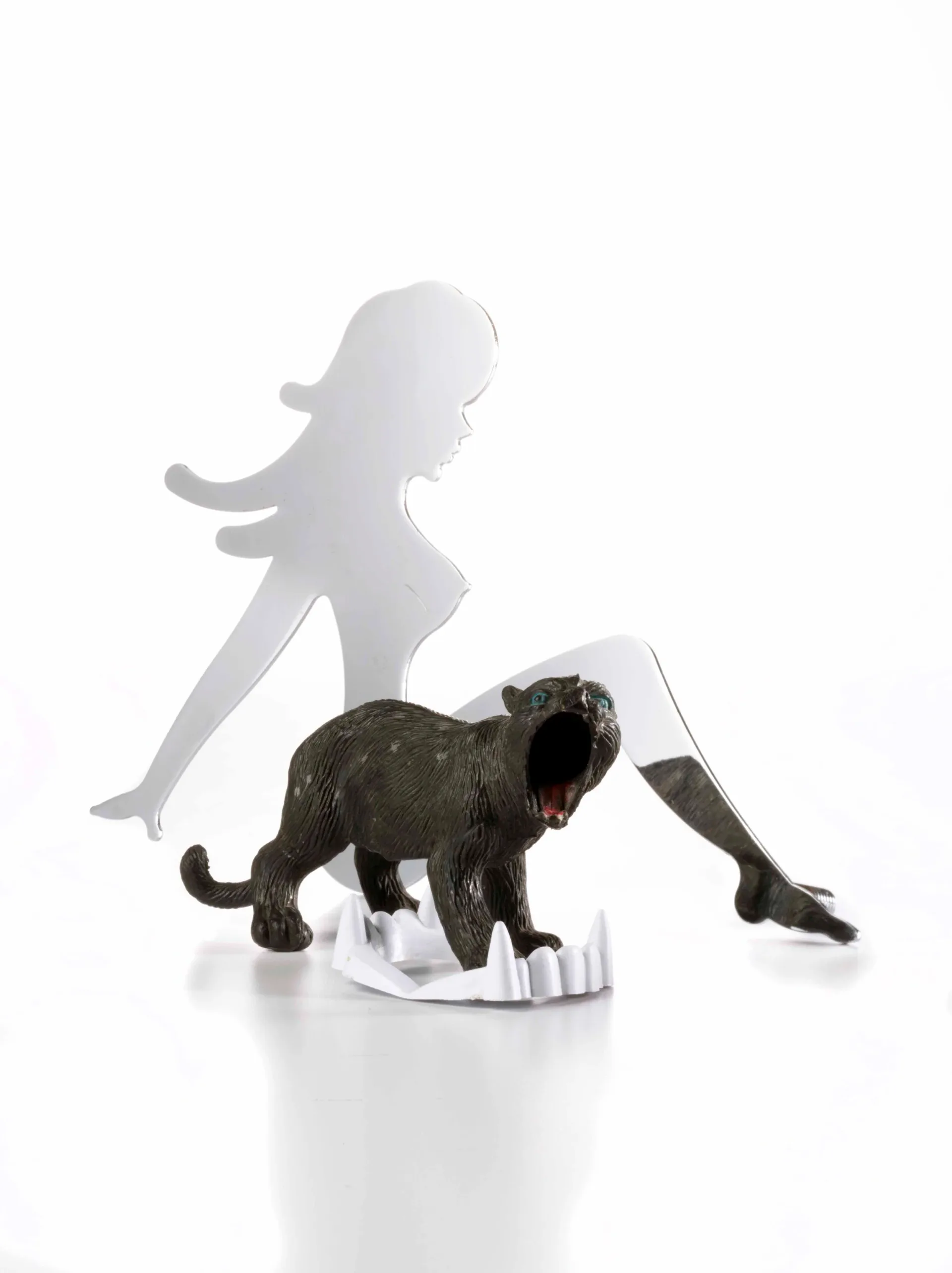 Crystal cut-glass trophy cup with a yellow sippy-cup lid sitting on an open black ring box