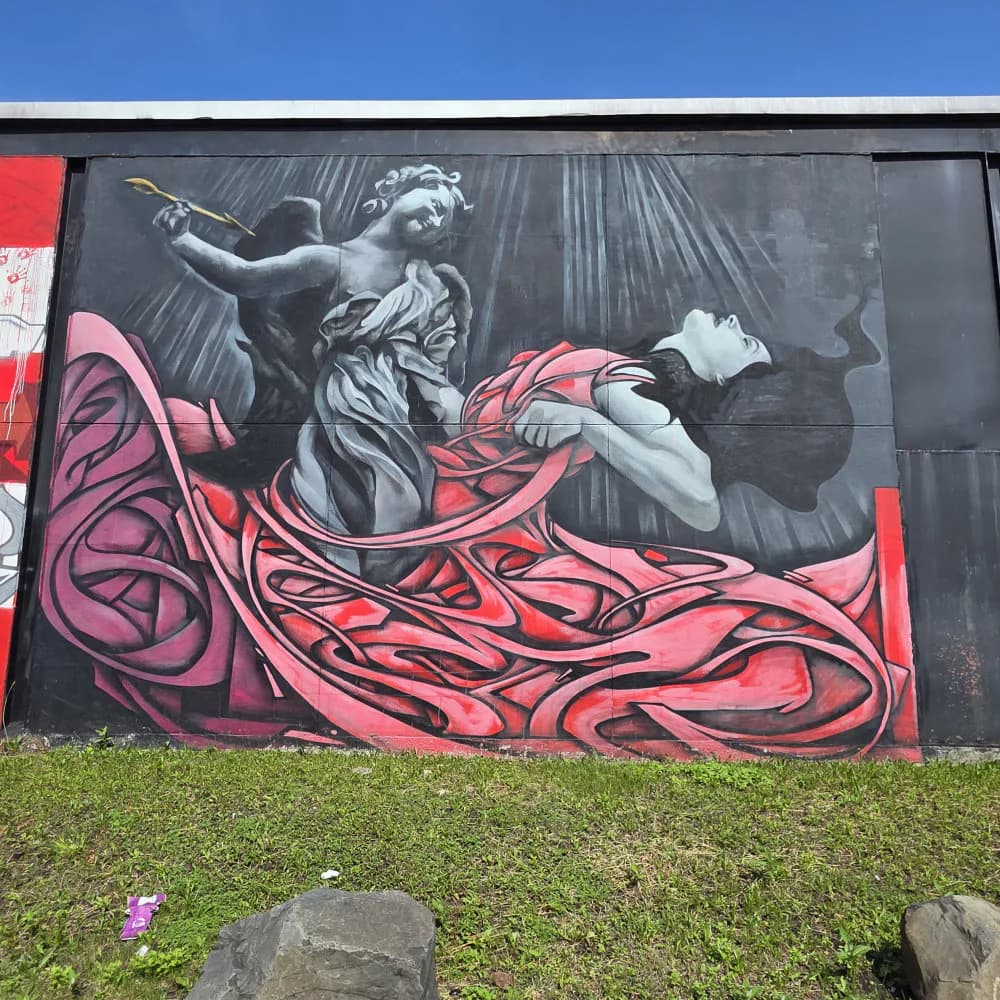 Mural of classical statuary figure in grayscale with flowing magenta and black abstract organic forms draped across lower composition.