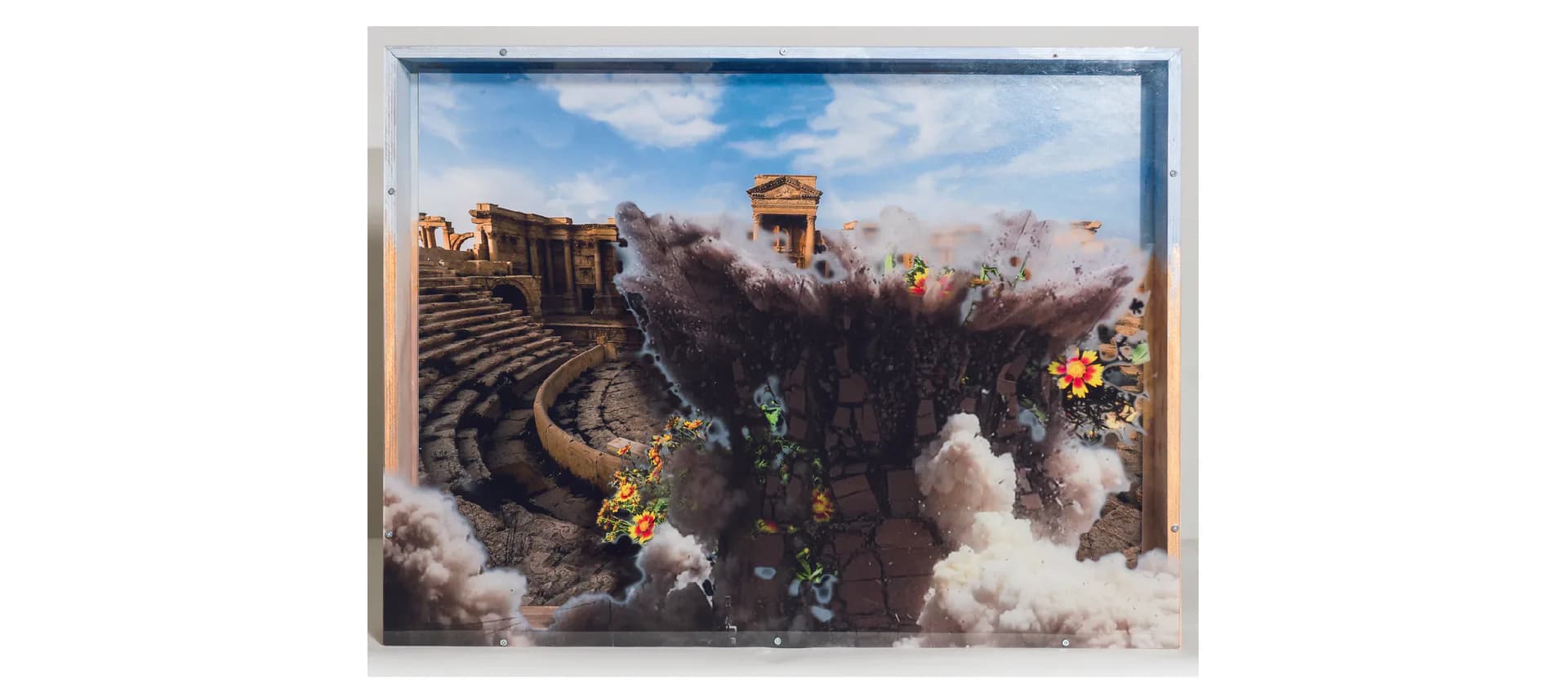 Mixed-media artwork depicting an ancient Roman amphitheater ruins with dramatic sky, mounted in a gray frame, featuring architectural and landscape elements.