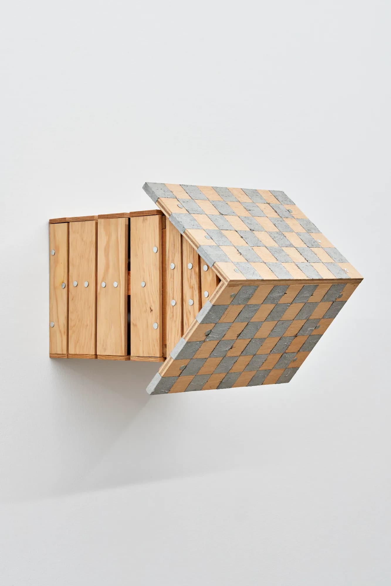 Three-dimensional wooden and concrete Blade Study form: natural wood box with vertical slats on left, concrete chevron shape on right with geometric checkerboard pattern.