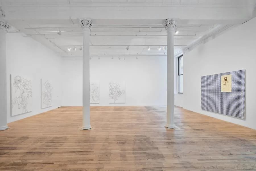 Bortolami gallery space with warm wooden floors, white walls, structural columns, abstract line drawings and a textured wall-mounted work visible.