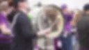Heavily blurred image with indistinct dark and light shapes; content cannot be reliably determined.