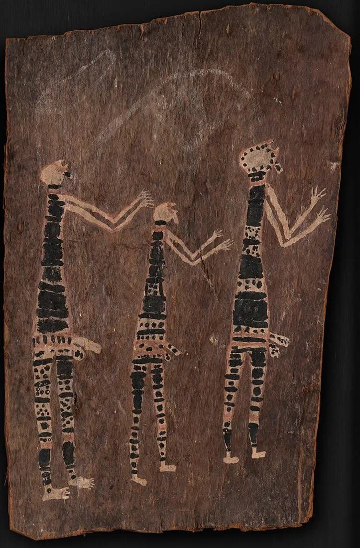 Three stylized human figures with geometric patterning on dark wood or bark, featuring intricate black and tan designs across torsos and limbs.
