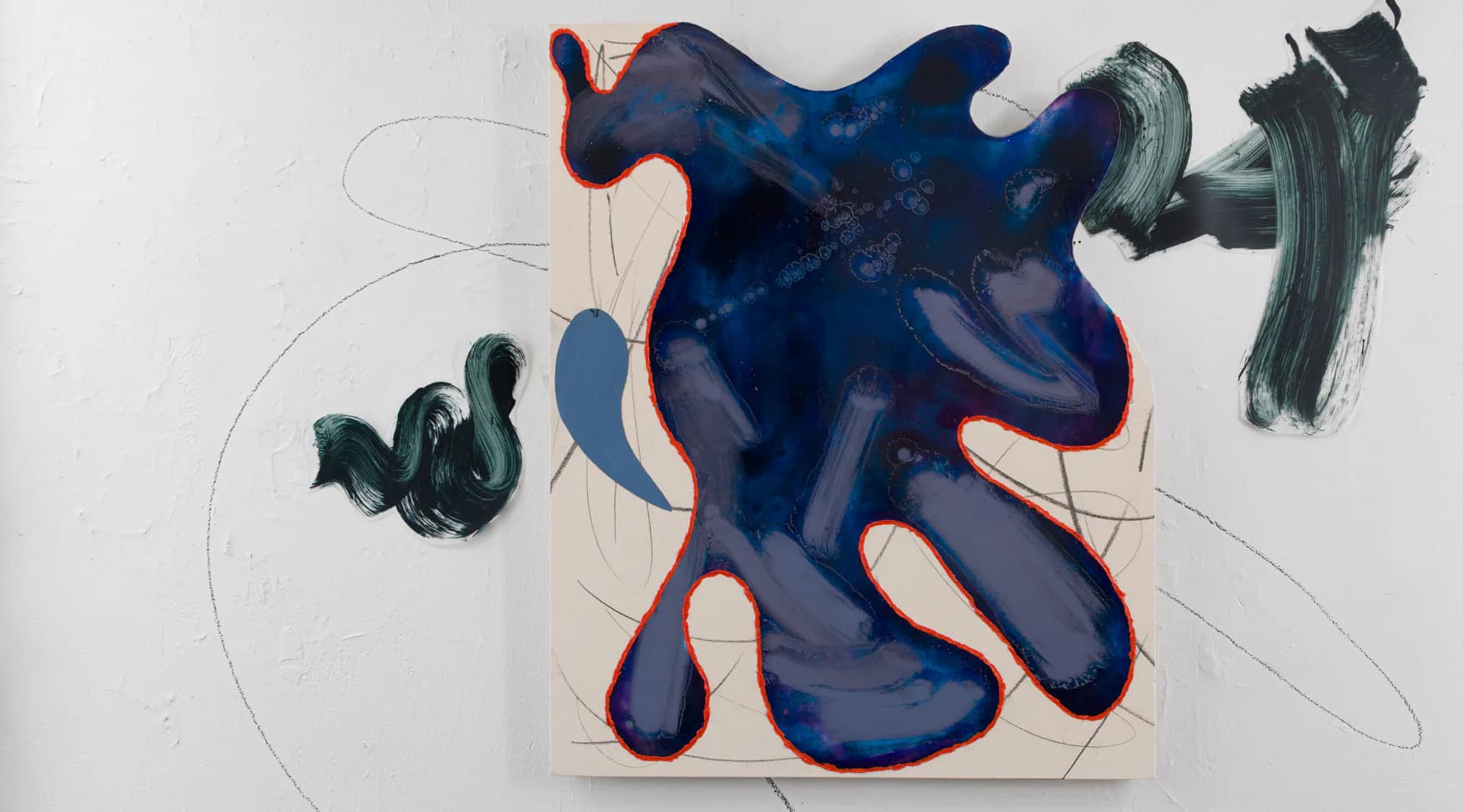 Mixed-media composition featuring an organic dark blue ink form on paper with red outlines, complementary pen sketches, and gestural line work.