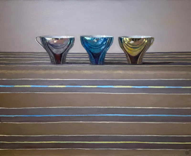 Three colored glass vessels—red, blue, and yellow—positioned on horizontal striped wooden shelving with subtle blue and tan linear elements.