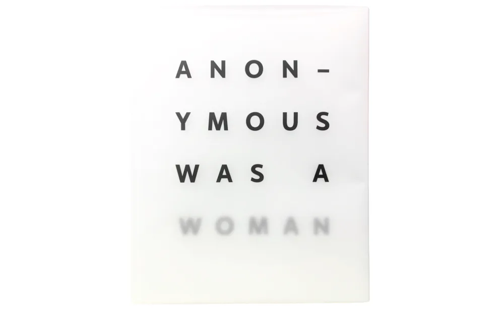 Typographic artwork on white background reading 'ANONYMOUS WAS A WOMAN' with the word 'WOMAN' rendered in faint gray text.