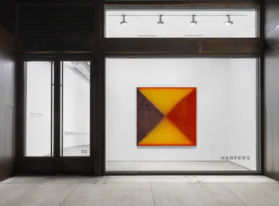 Harper's gallery storefront with geometric abstract painting in yellow, red, and brown tones displayed in large window against white wall.