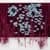 Dark burgundy textile or mixed-media work with intricate white floral or crystalline pattern throughout.