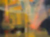 Blurred abstract image with warm yellow and orange tones and dark shadows; subject indeterminate.