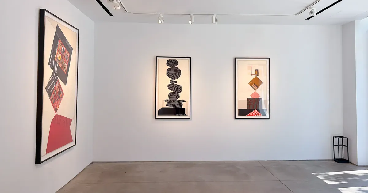 Gallery interior at Kathryn Markel Fine Arts showing three framed abstract artworks on white walls with track lighting and polished concrete floor.