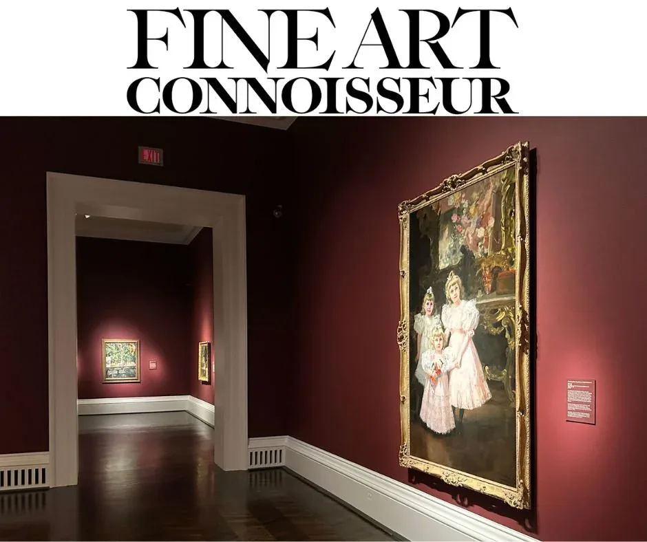 Gallery interior with burgundy walls displaying a large framed portrait painting on the right and a doorway leading to another exhibition space.