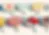 Blurred or heavily pixelated abstract composition with indistinct colored shapes.