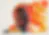 Low-resolution abstract image with warm orange and red tones, details unclear.
