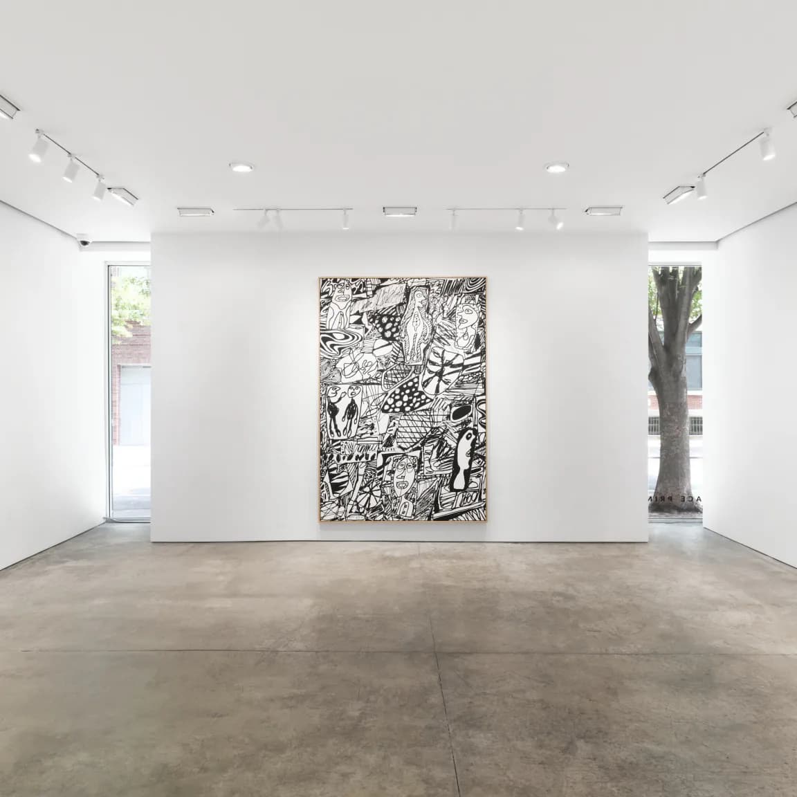 Minimalist gallery interior with polished concrete floor, white walls, track lighting, and a single large black-and-white intricate drawing displayed centrally.