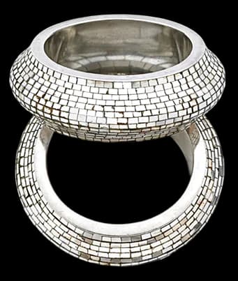 Wide silver metal band ring featuring geometric mosaic-tile surface pattern, shown front and back views.