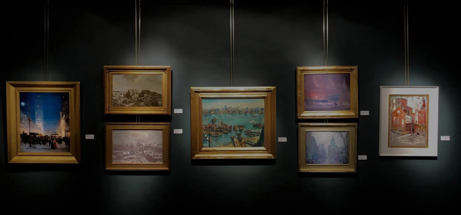 Gallery wall with five framed paintings displayed on dark background under spotlights, including landscape and figurative works.