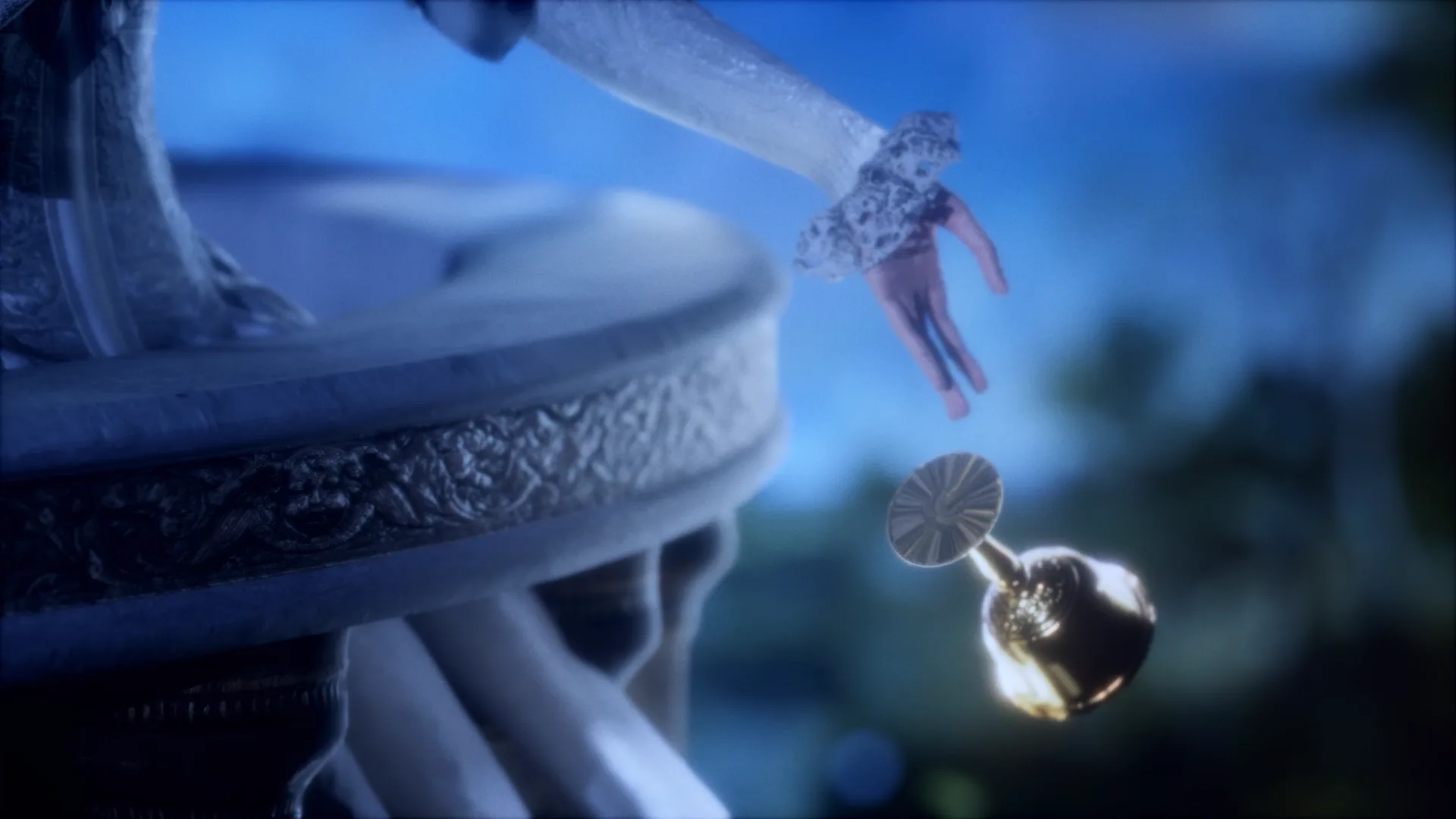 Close-up of crystalline or sculptural form with suspended figure and dangling spherical object against blue background.