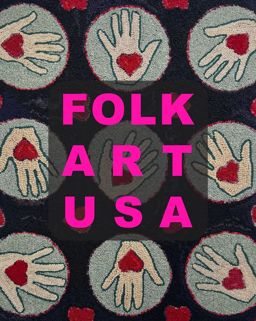 Textile or fiber art featuring embroidered hands with red hearts on dark navy background, with magenta text reading 'FOLK ART USA'.