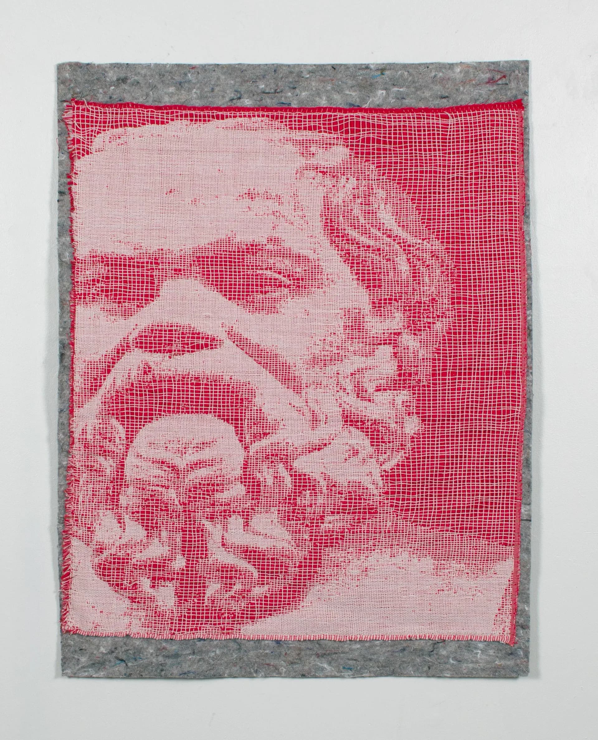 Red and pink pixelated portrait on gray background, textile or woven mixed media work.