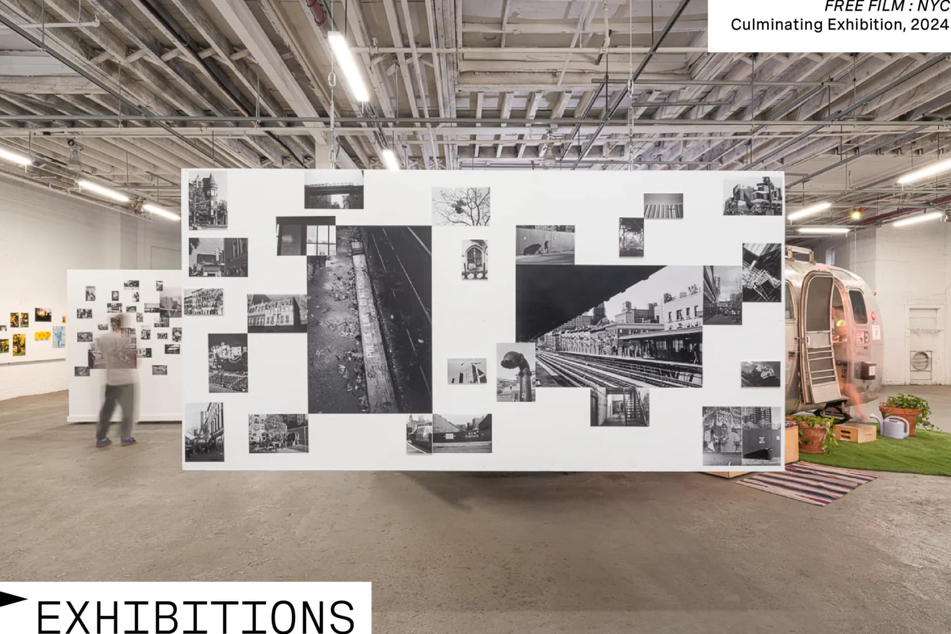 Large warehouse gallery interior with black-and-white photographs arranged on white wall panel; labeled Exhibitions; Culminating Exhibition 2024.