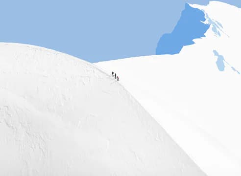 Minimalist landscape photograph of small figures traversing a white snowy slope beneath clear blue sky.